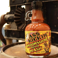 Ass Kickin' Moonshine Pepper Mash on an oak barrel.