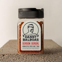 Danny Balboa's Season Seagal Asian Style Spice Rub. 150 grams. Photographed on a concrete slab.